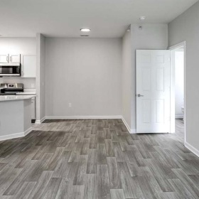 a living room with hardwood floors